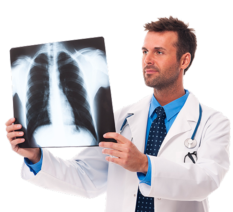 A male doctor holding up and analyzing a chest X-ray scan
